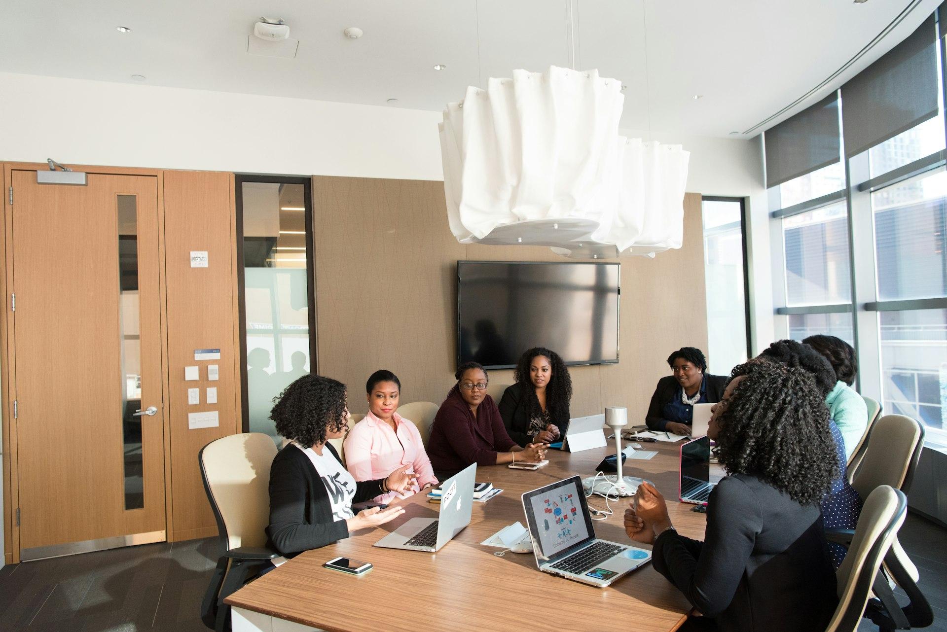 Consultants in discussion over a client brief
